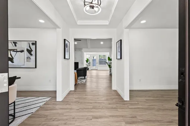 wooden floor in a hall with an entryway