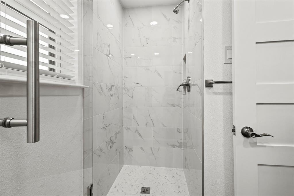 4105 Candlenut Lane Dallas, TX 75244 - Photo 22 of 27 a bathroom with a shower
