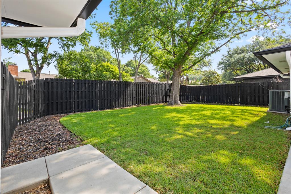 4105 Candlenut Lane Dallas, TX 75244 - Photo 24 of 27 a view of a back yard