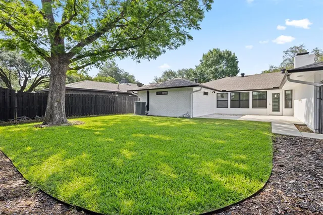 a house view with a garden space