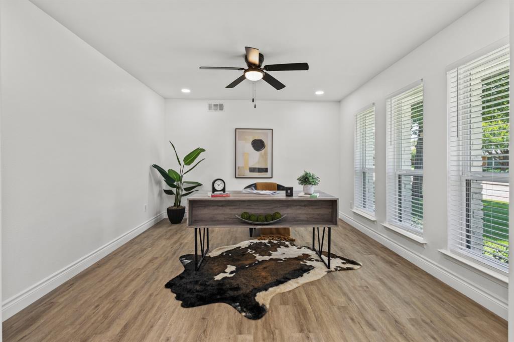 4105 Candlenut Lane Dallas, TX 75244 - Photo 3 of 27 a view of a workspace with furniture and a window