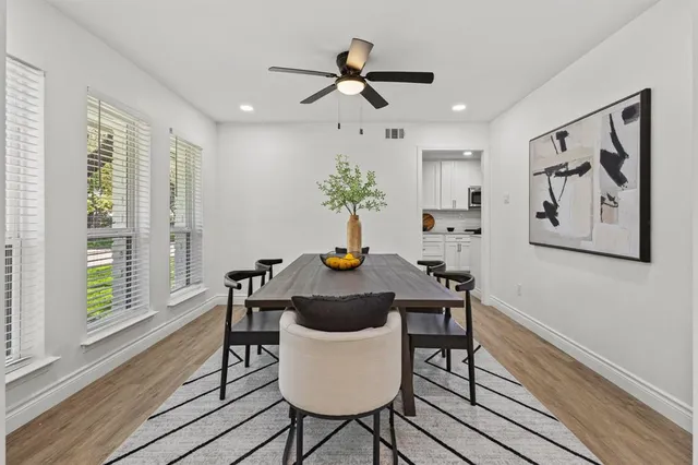 a table that has a lamp on a table and a chandelier