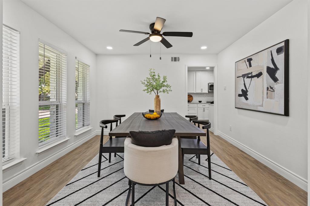 4105 Candlenut Lane Dallas, TX 75244 - Photo 5 of 27 a table that has a lamp on a table and a chandelier