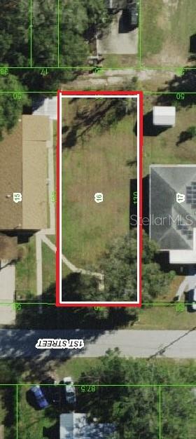 14306 1st Street Dade City, FL 33525 - Photo 4 of 9 a view of swimming pool with a yard