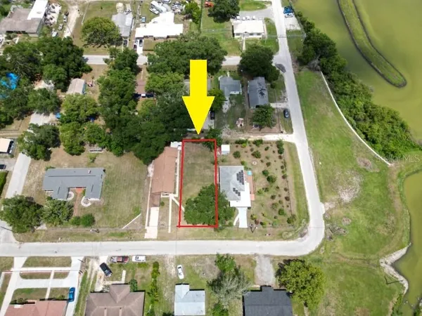 an aerial view of a house with swimming pool