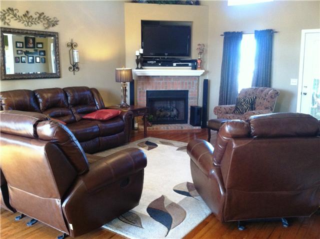 455 Clearview Road Cottontown, TN 37048 - Photo 2 of 20 Gleaming hardwoods, nice window treatments, and architectural details adorn wonderfully open living room with plenty of space for cozy furniture.