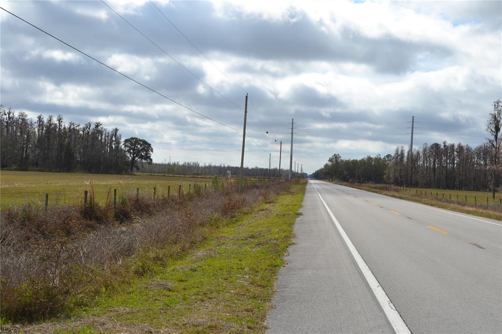 0 Moore Road Lakeland, FL 33809 - Photo 2 of 23 a view of a lake with a big yard