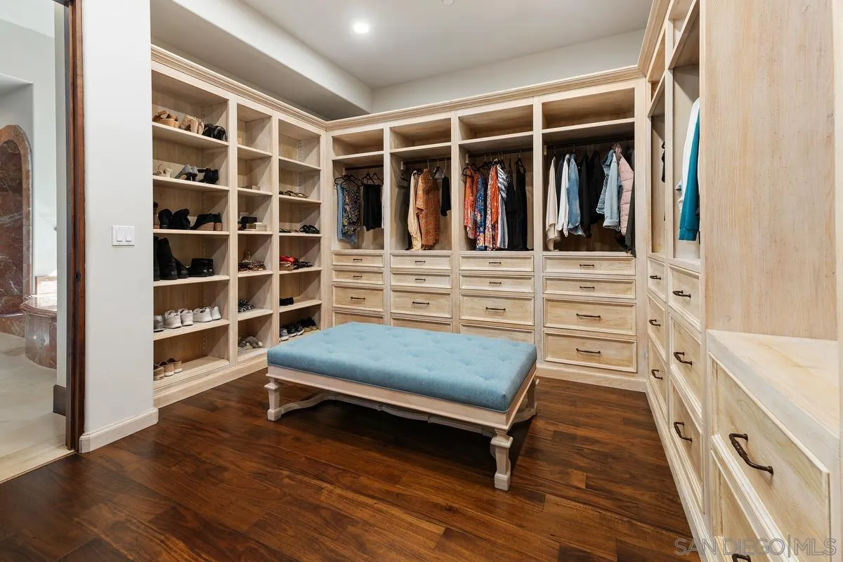 14778 El Rodeo Court Rancho Santa Fe, CA 92067 - Photo 15 of 28 a view of walk in closet with clothes and shoes