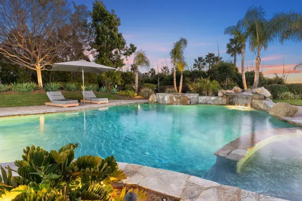 a view of a swimming pool with a patio