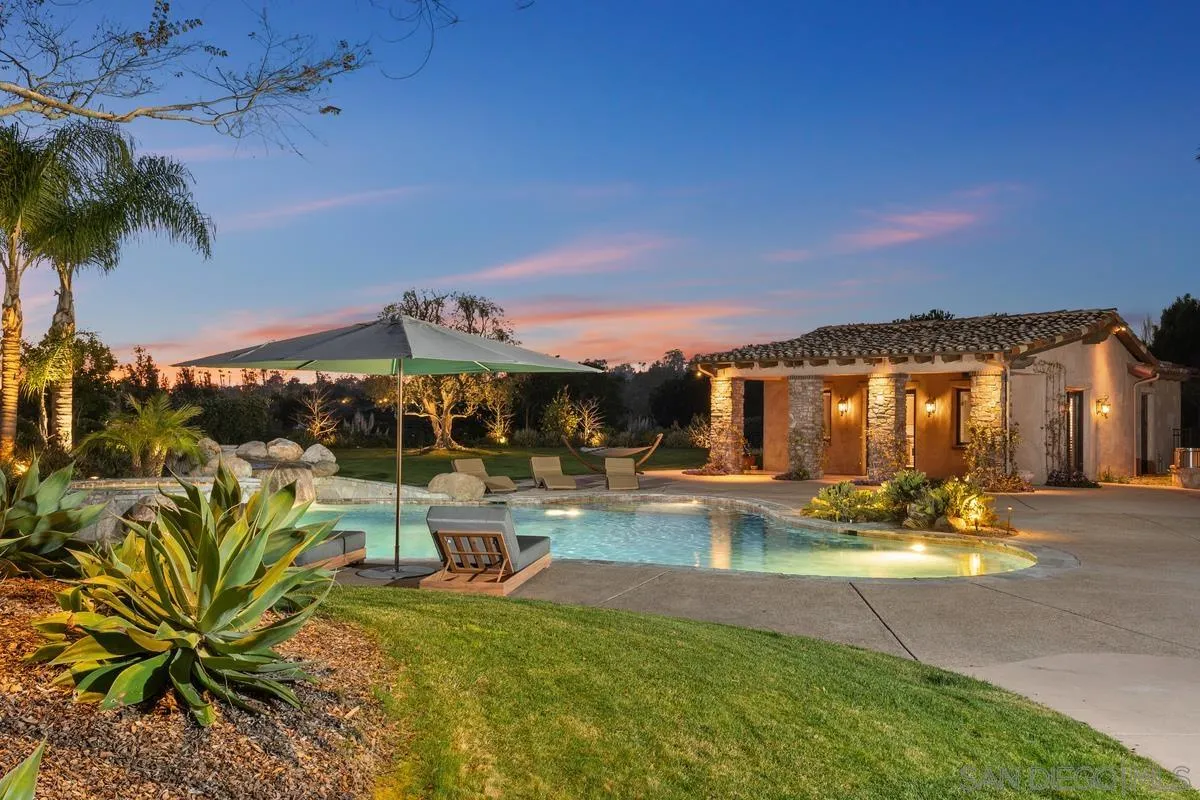 14778 El Rodeo Court Rancho Santa Fe, CA 92067 - Photo 28 of 28 a view of a swimming pool with a patio