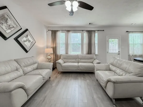 a living room with furniture and a large window