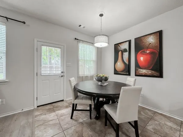 a view of a dining room with furniture