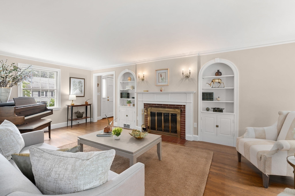 16 Bailey Lane Dedham, MA 02026 - Photo 11 of 40 a living room with furniture and a fireplace