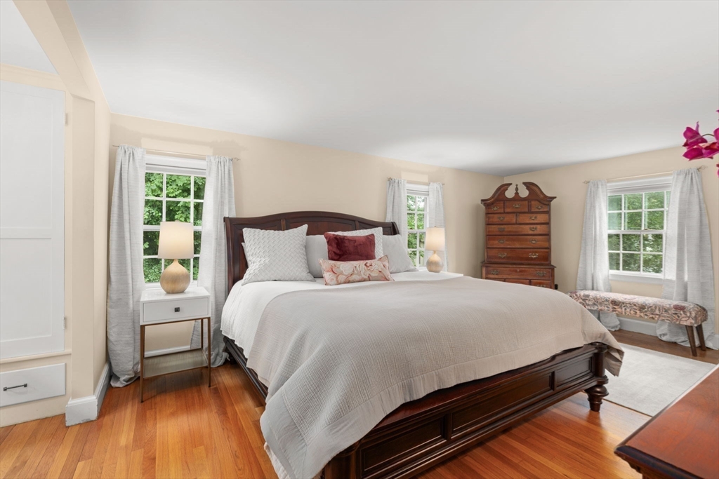 16 Bailey Lane Dedham, MA 02026 - Photo 20 of 40 a bedroom with a bed and a window