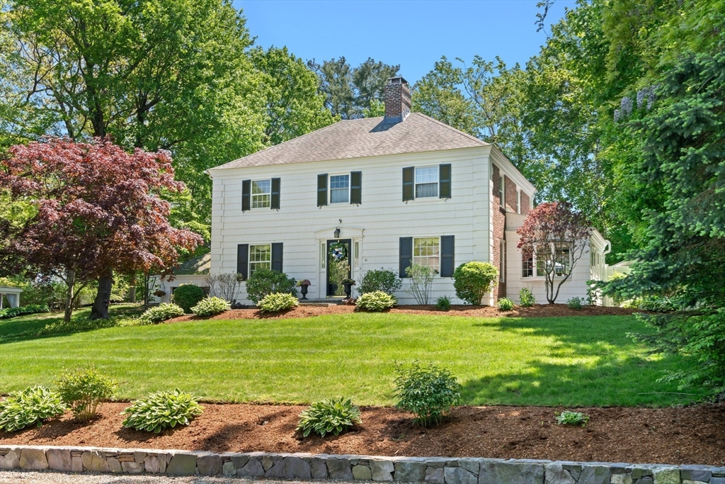 16 Bailey Lane Dedham, MA 02026 - Photo 2 of 40 a front view of a house with a yard