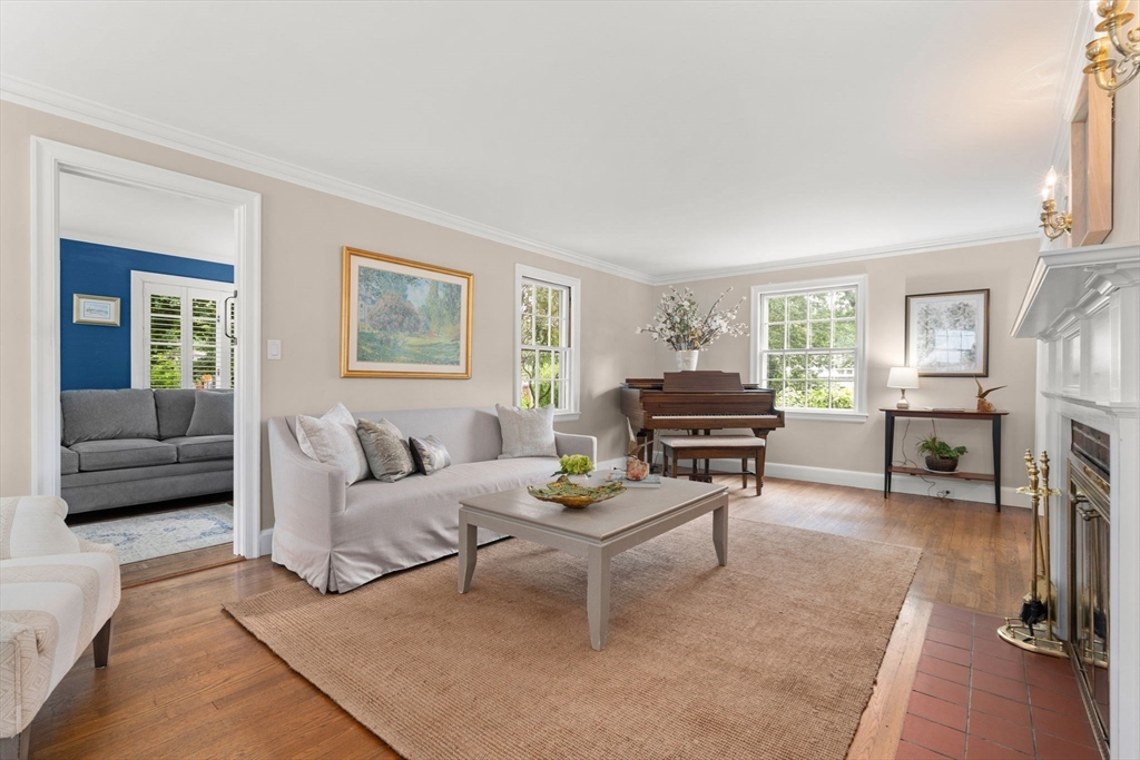 16 Bailey Lane Dedham, MA 02026 - Photo 10 of 40 a living room with furniture and a fireplace