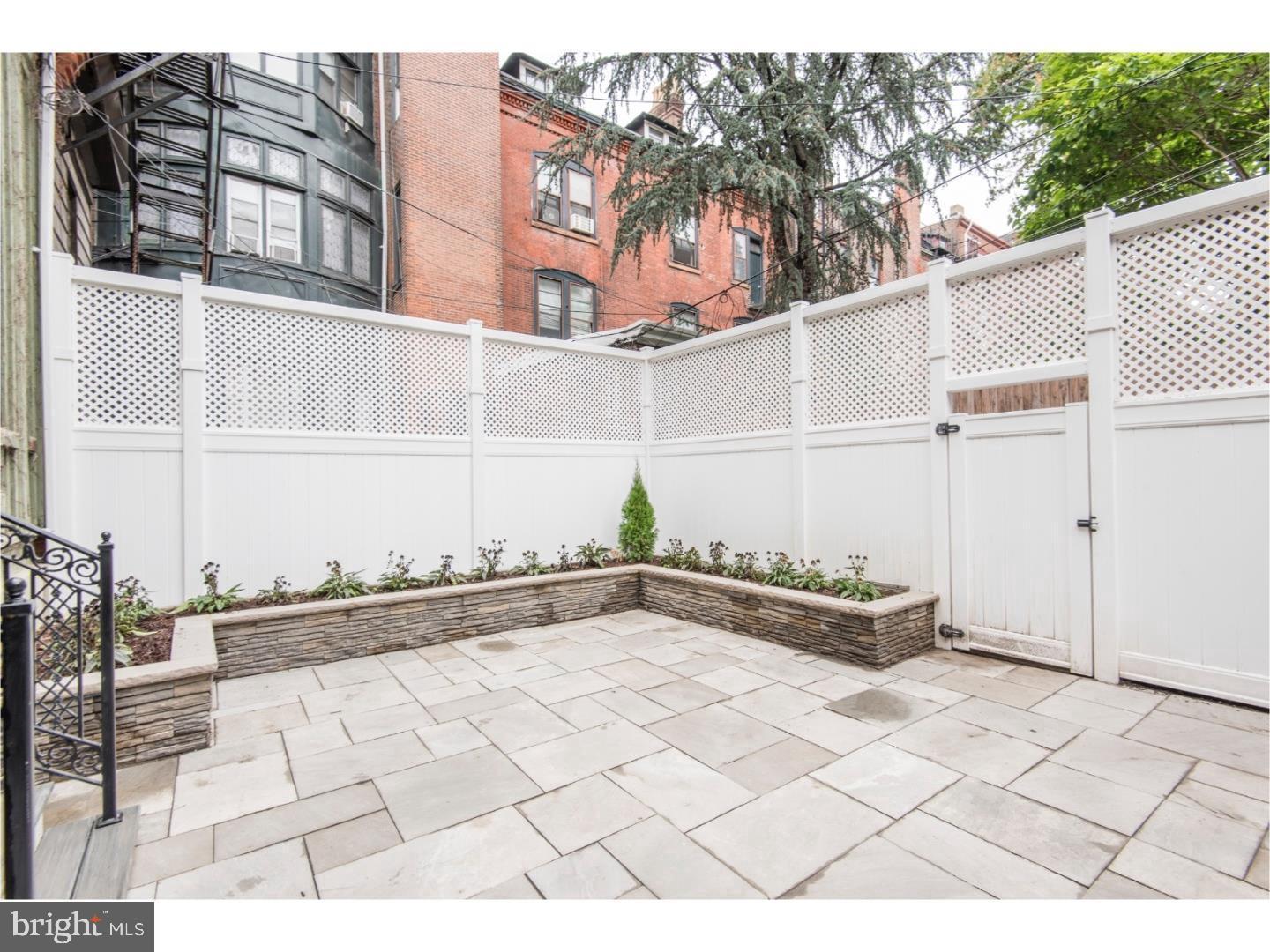 2129 Walnut Street, Unit 1 Philadelphia, PA 19103 - Photo 5 of 7 a view of a terrace with a bench