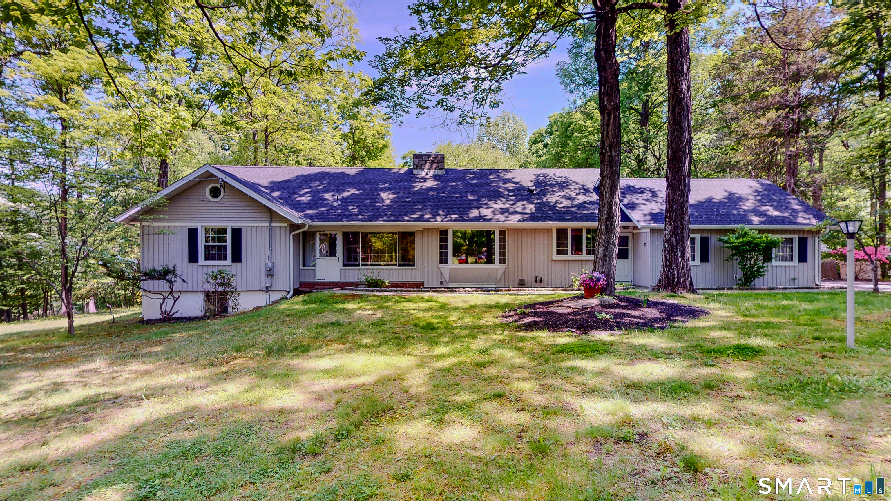 133 Chambers Road Danbury, CT 06811 - Photo 1 of 30 a view of a house with a yard patio and fire pit