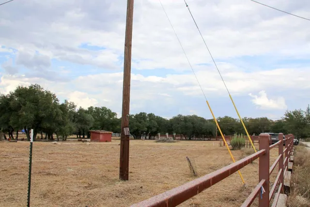 a view of a yard with trees