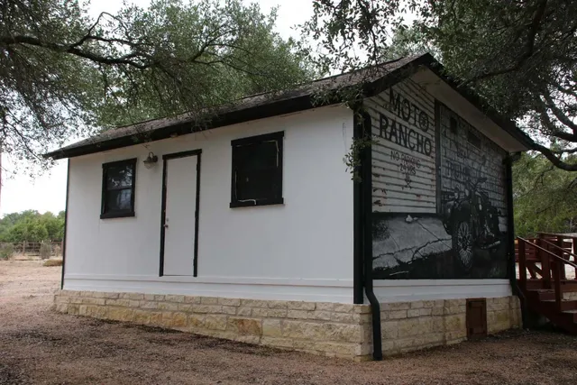 a view of a house with backyard and deck