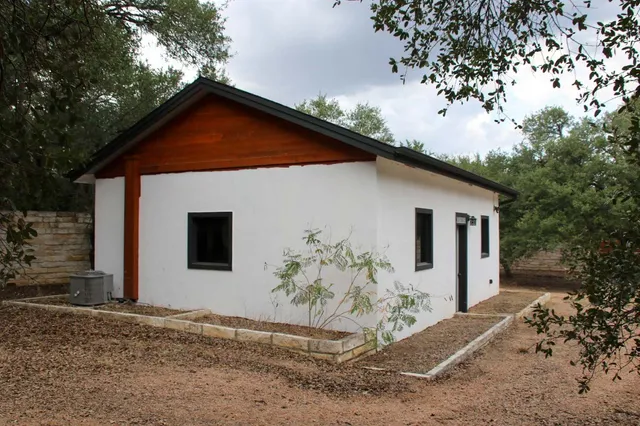 a view of a barn with a small yard