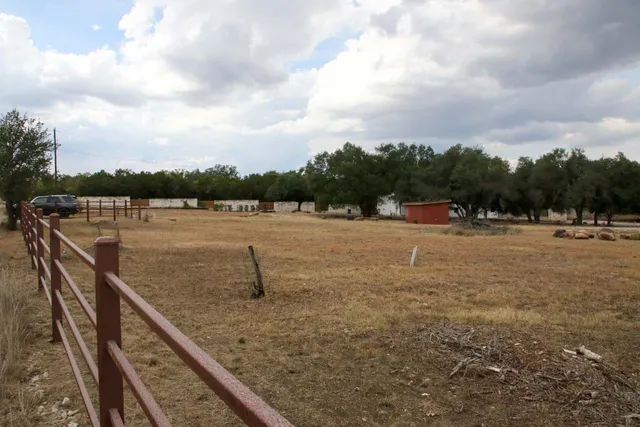 a view of outdoor space with deck and yard