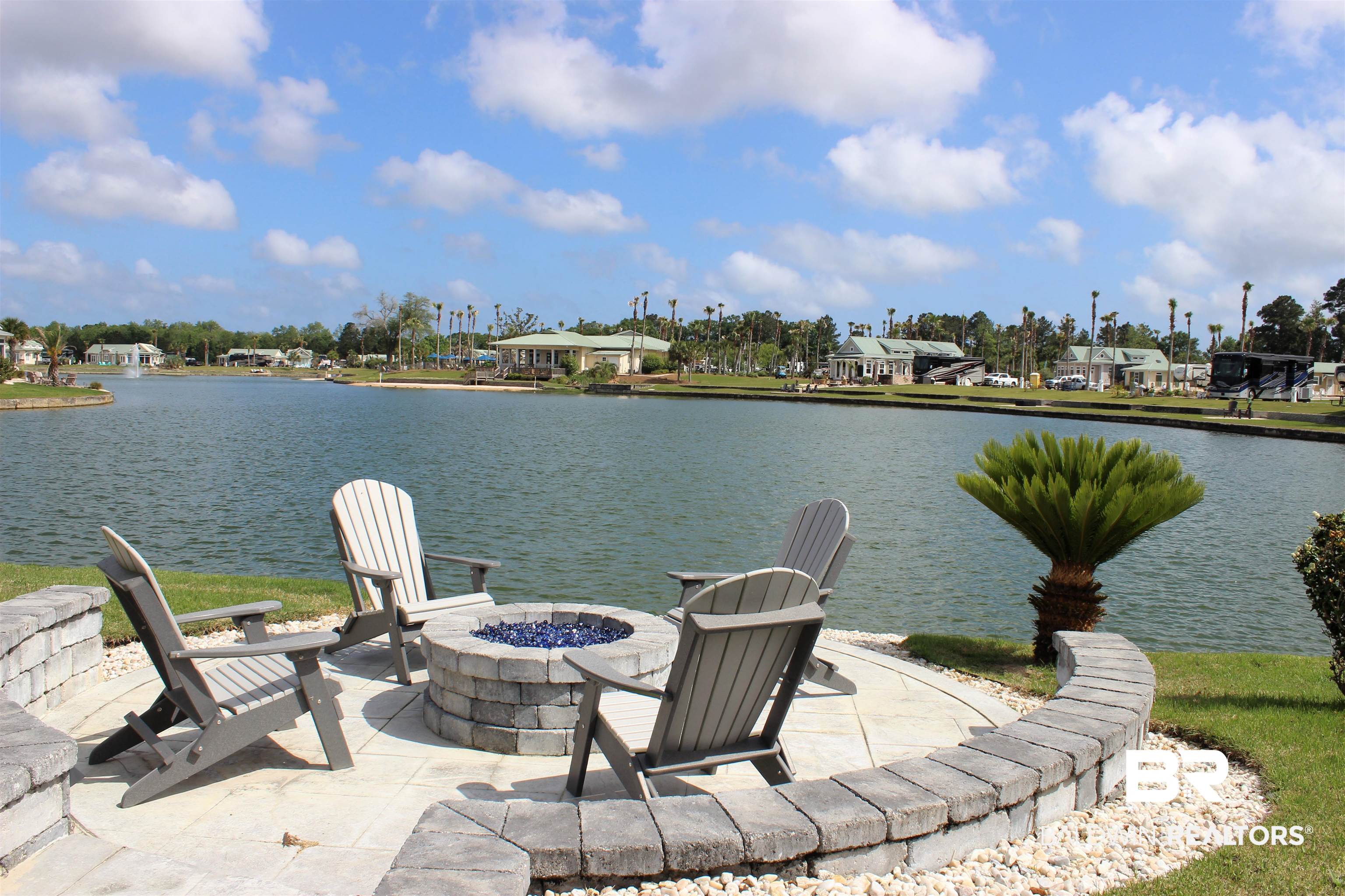 28058 Migratory Way, Unit 100 Elberta, AL 36530 - Photo 2 of 83 Exterior space featuring a fire pit and a water view