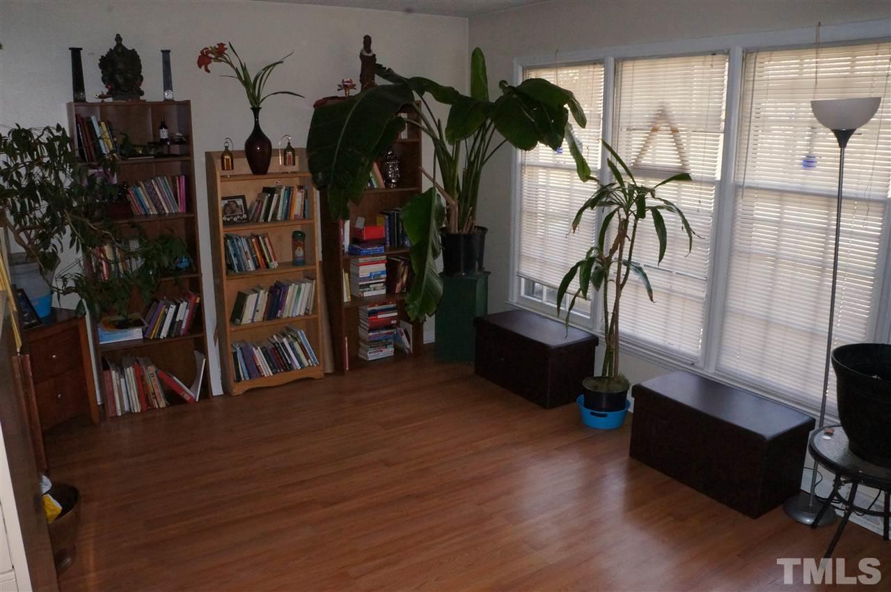 4600 Paisley Court Raleigh, NC 27604 - Photo 3 of 16 a living room with furniture and a potted plant