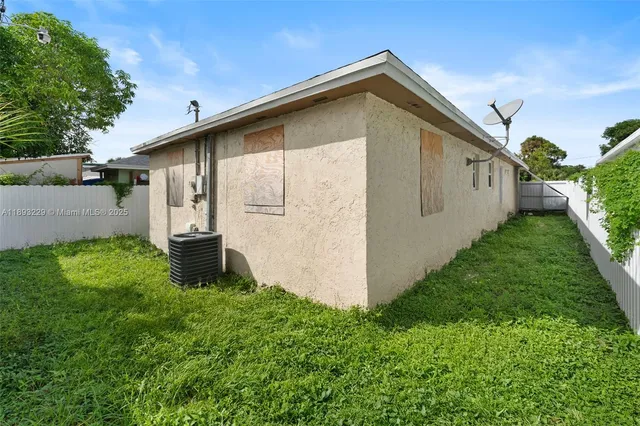 a backyard of a house with lots of green space