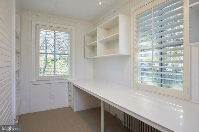 a room with cabinets and a window
