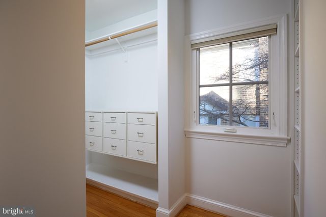 a view of a hallway with seating area