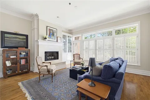 a living room with furniture fireplace and a flat screen tv