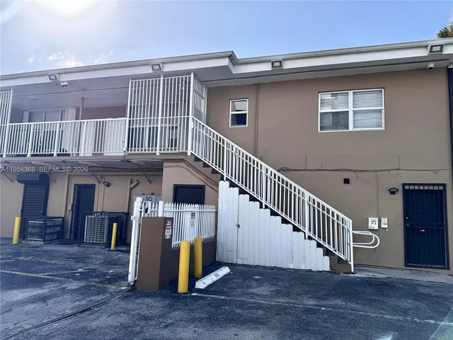 a view of a house with a deck and a fireplace