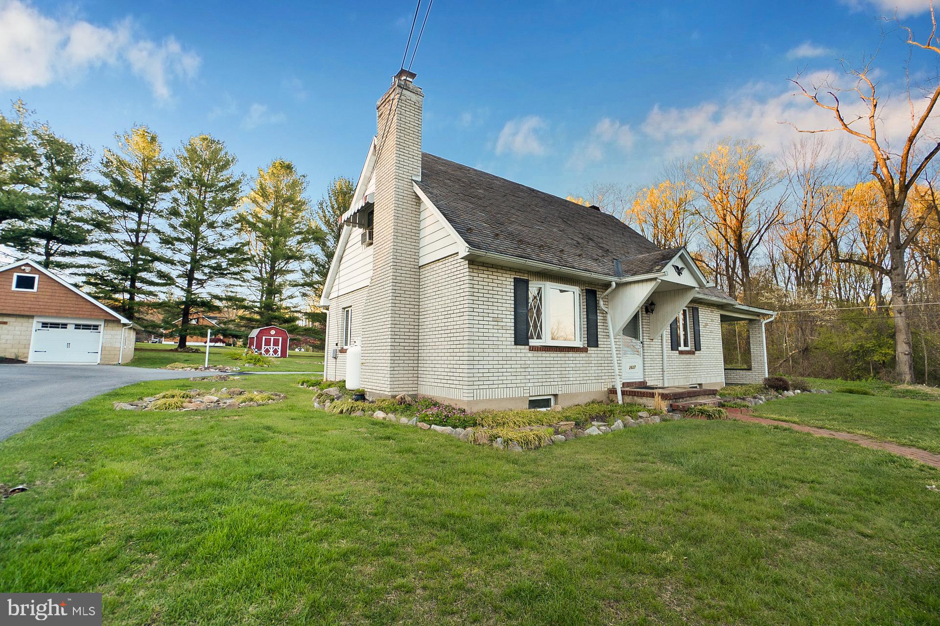 2627 Welshtown Road Slatington, PA 18080 - Photo 3 of 32 a front view of a house with a garden