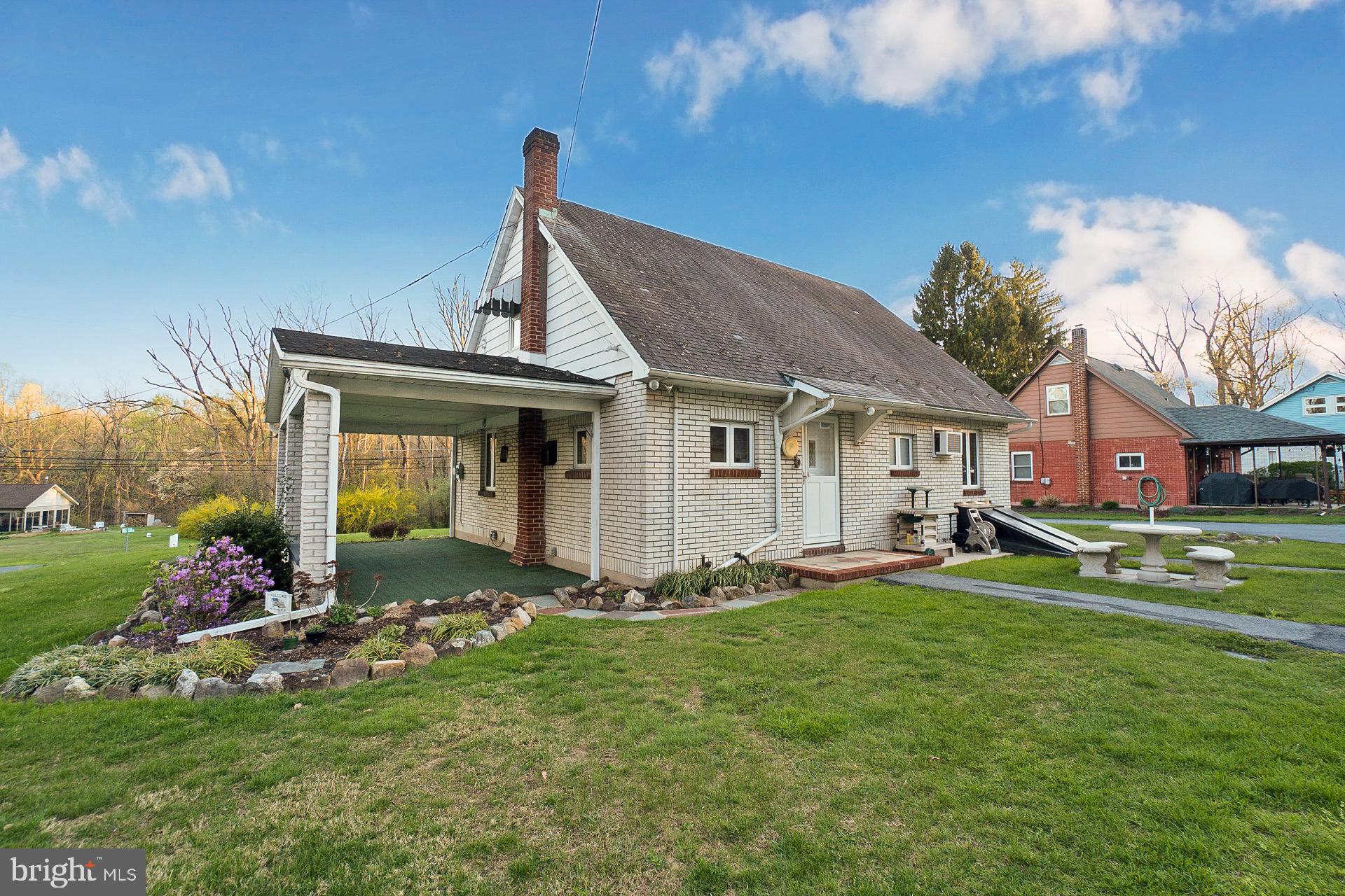 2627 Welshtown Road Slatington, PA 18080 - Photo 27 of 32 a front view of a house with a garden