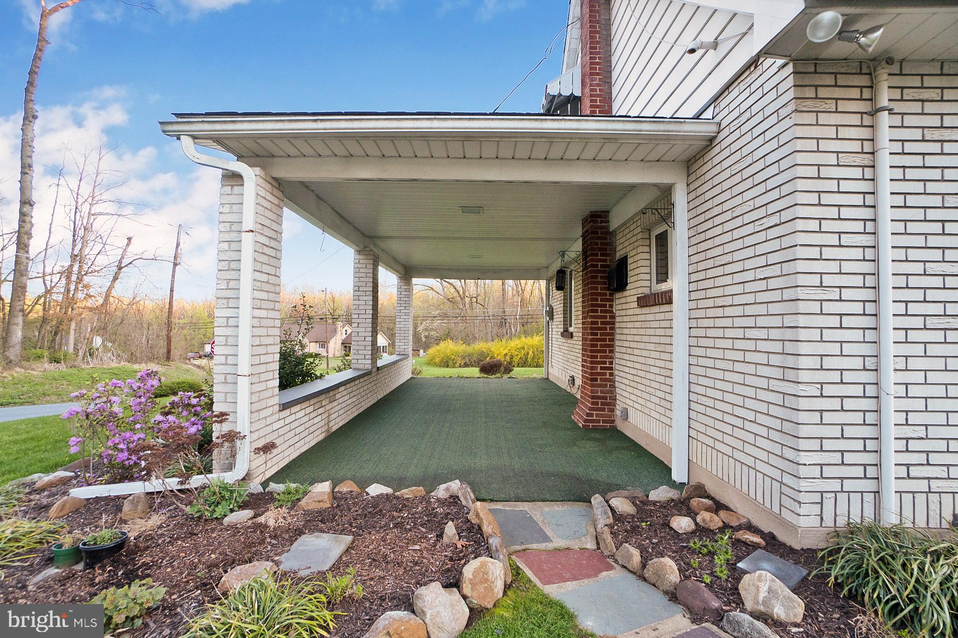 2627 Welshtown Road Slatington, PA 18080 - Photo 32 of 32 a view of a porch with a potted plant