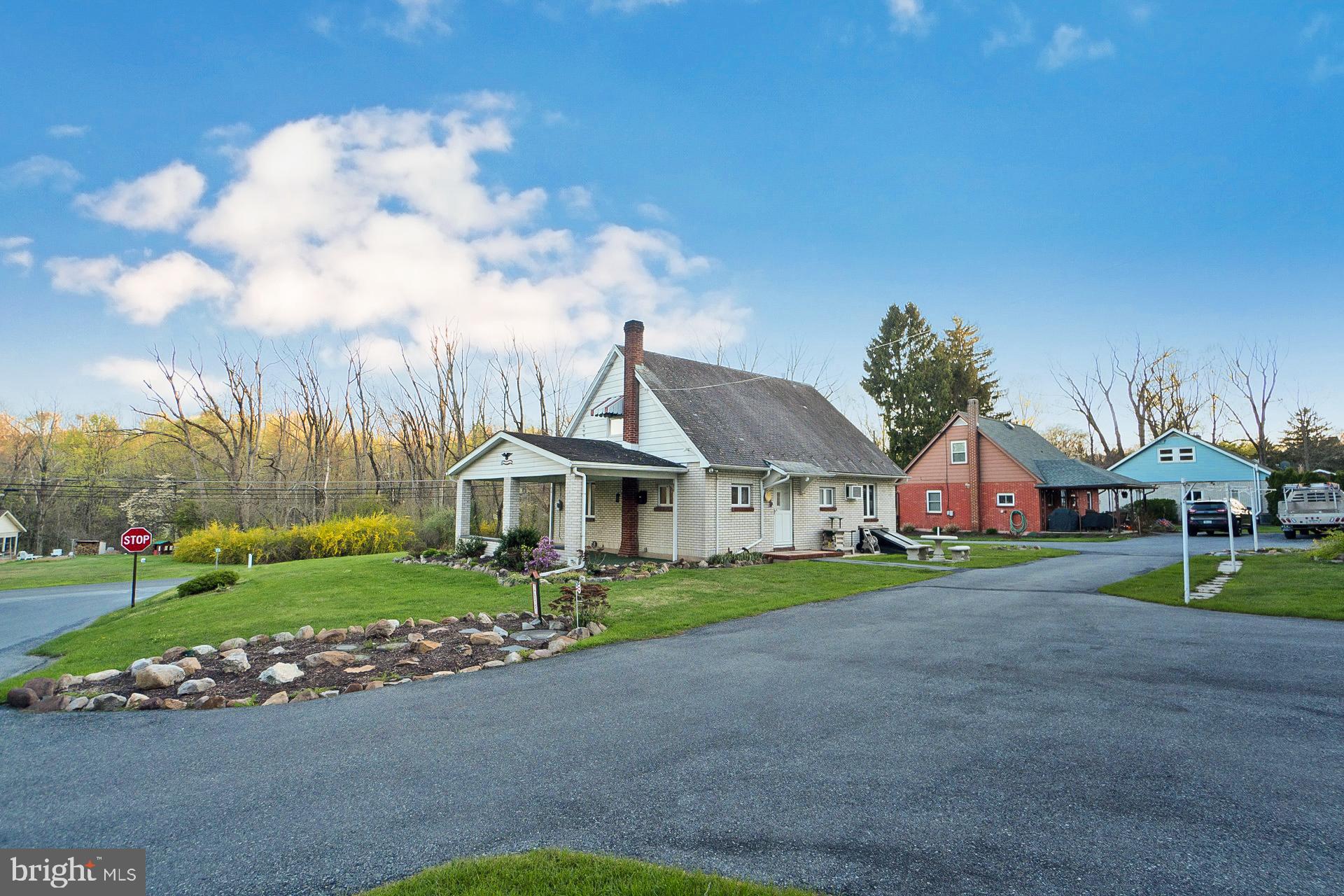 2627 Welshtown Road Slatington, PA 18080 - Photo 5 of 32 a front view of a house with a yard and garage