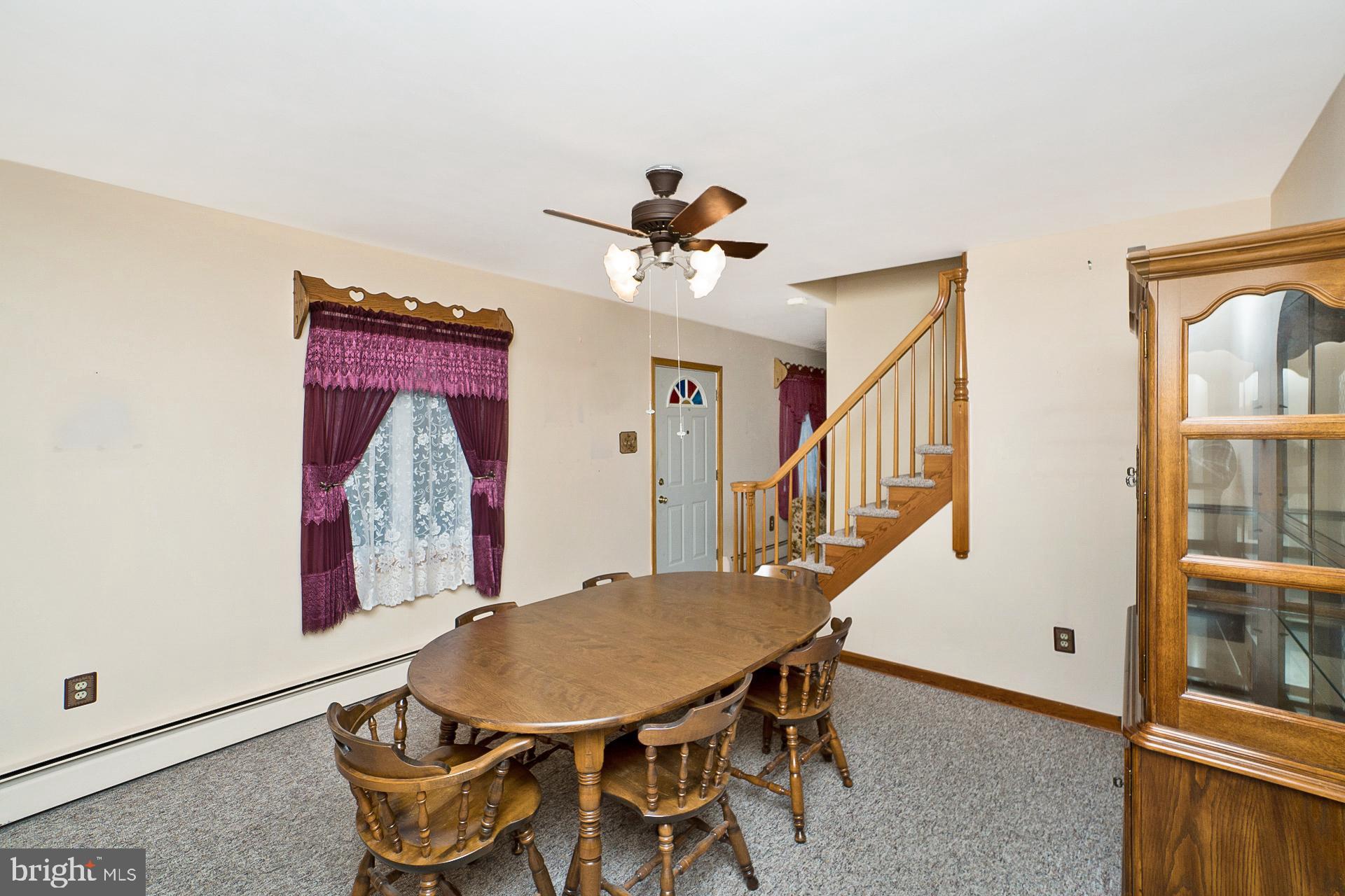2627 Welshtown Road Slatington, PA 18080 - Photo 10 of 32 a view of a dining room with furniture and a chandelier