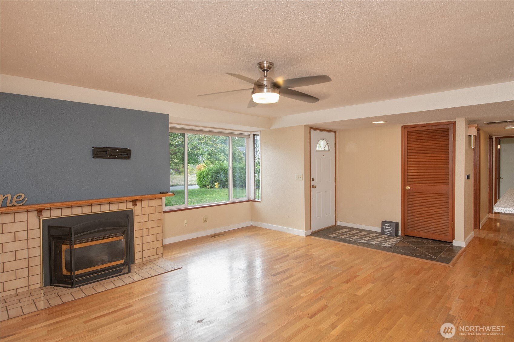 1919 Clovercrest Street Enumclaw, WA 98022 - Photo 13 of 30 a view of empty room with wooden floor and fireplace