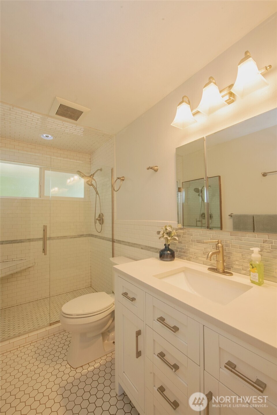 1919 Clovercrest Street Enumclaw, WA 98022 - Photo 14 of 30 a bathroom with a sink a toilet and shower
