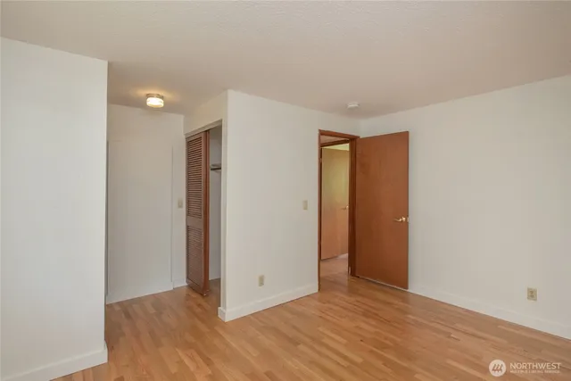 a view of a bedroom and utility room