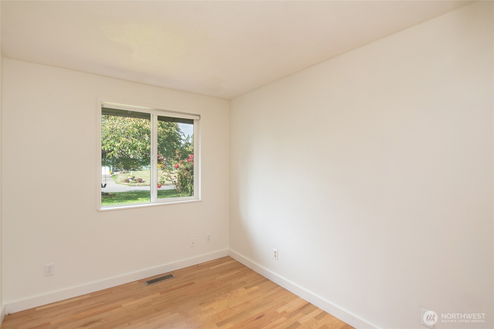 1919 Clovercrest Street Enumclaw, WA 98022 - Photo 20 of 30 an empty room with wooden floor and a window