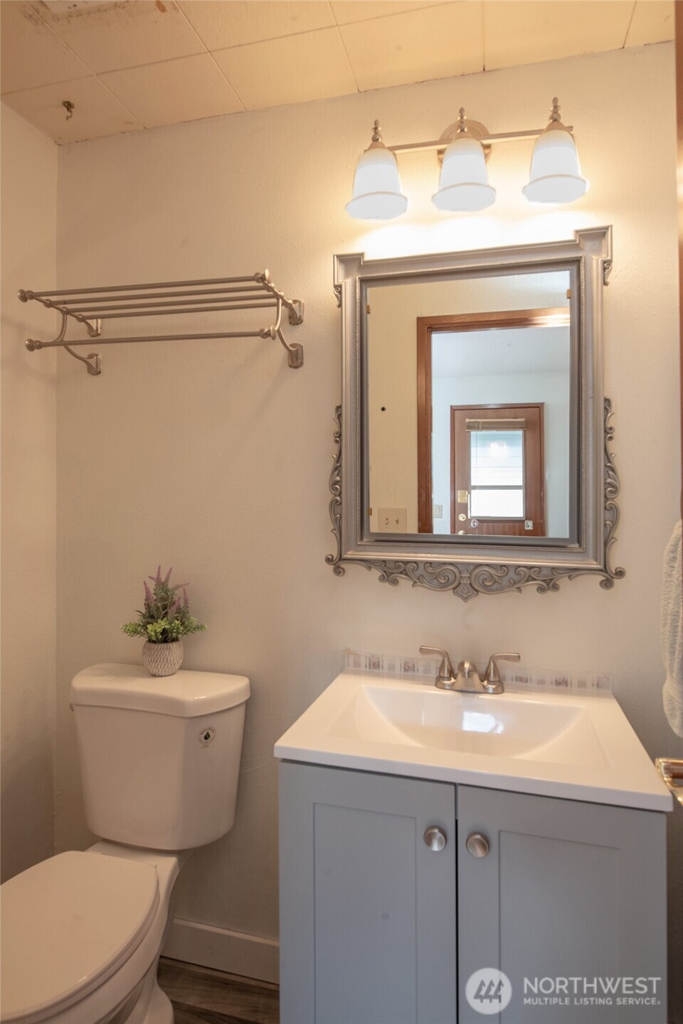 1919 Clovercrest Street Enumclaw, WA 98022 - Photo 23 of 30 a bathroom with a sink a mirror and a toilet