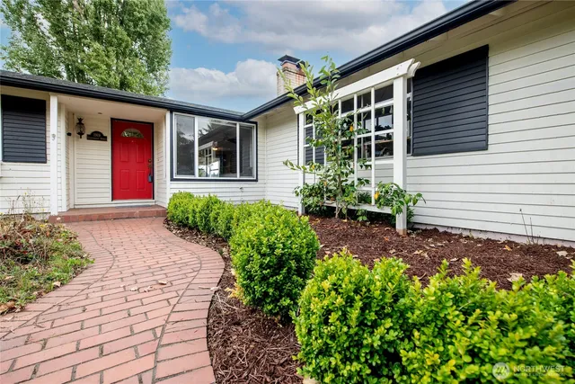 a front view of a house with garden