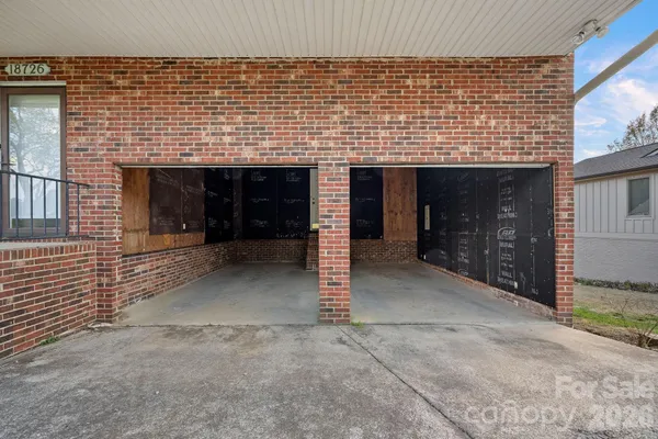 a front view of a house with a garage