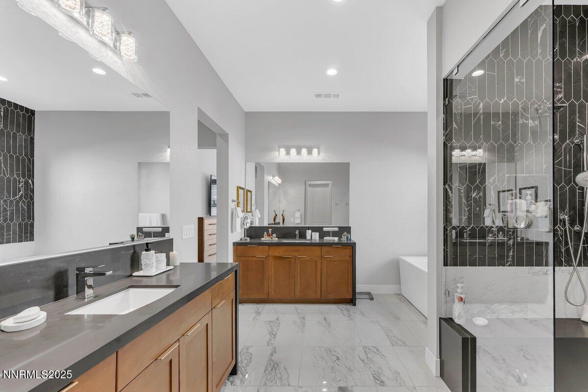 6119 South Pleasant Oak Trail Reno, NV 89511 - Photo 21 of 44 a large bathroom with a granite countertop double vanity sink a mirror and a shower