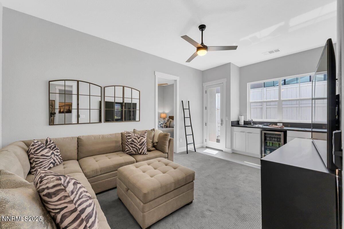 6119 South Pleasant Oak Trail Reno, NV 89511 - Photo 23 of 44 a living room with furniture and kitchen view