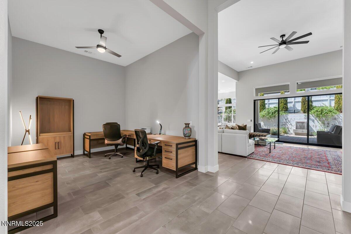 6119 South Pleasant Oak Trail Reno, NV 89511 - Photo 29 of 44 a living room with furniture and wooden floor