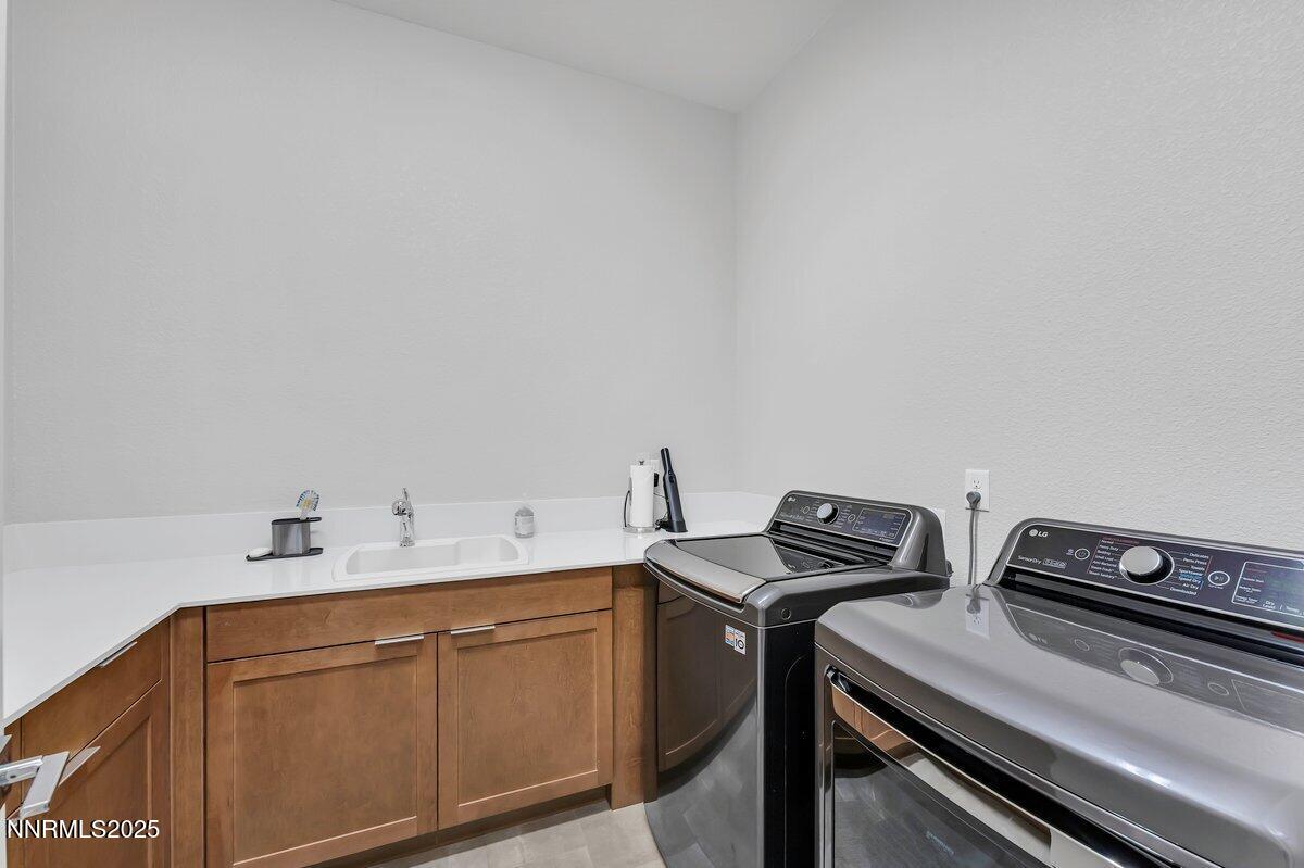 6119 South Pleasant Oak Trail Reno, NV 89511 - Photo 32 of 44 a utility room with sink dryer and washer