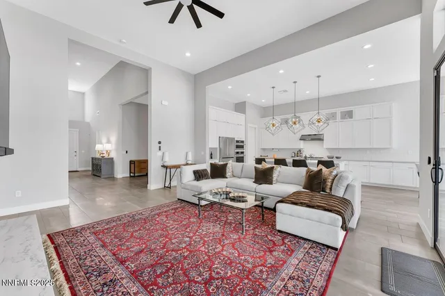 a living room with furniture and a rug